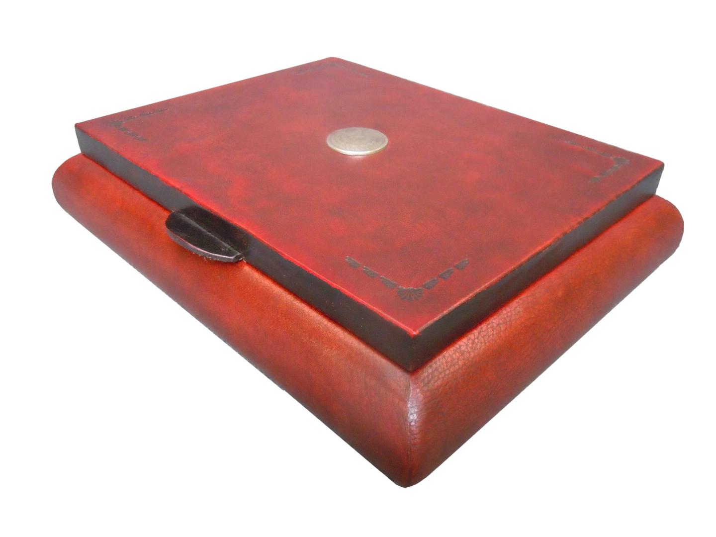leather box with beautiful concho/shell design on the top of the piece